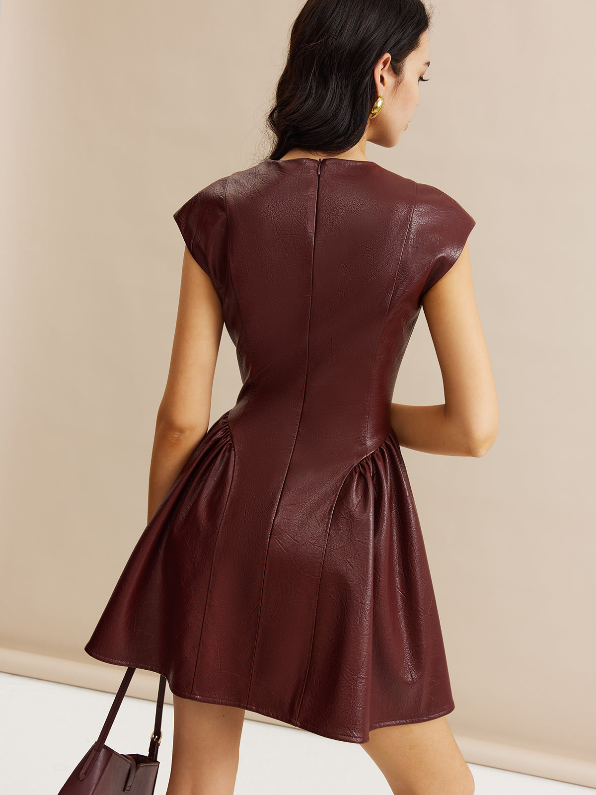 Miraclelace – Plissiertes Kleid mit Einsätzen aus Kunstleder