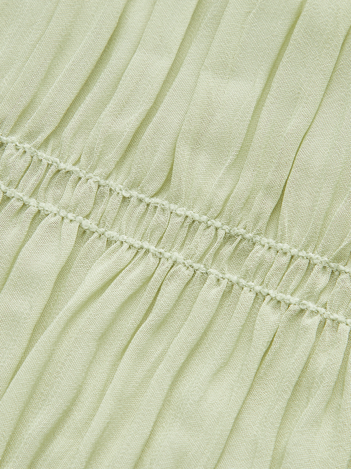 Shimwind – Halbtransparentes Plisseekleid mit Riemchen