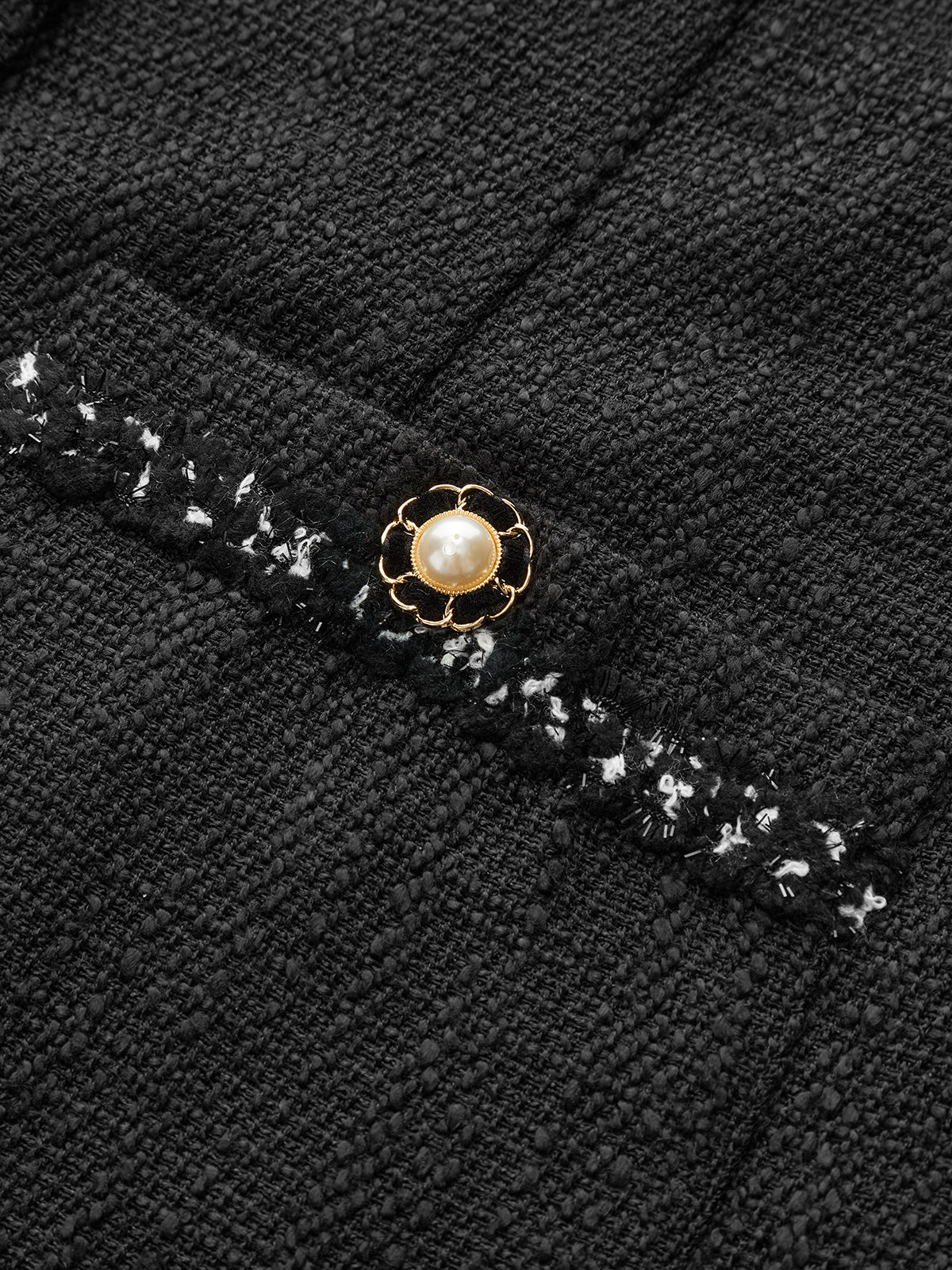 Ärmlös miniklänning i tweed med knappar i etherene-modell