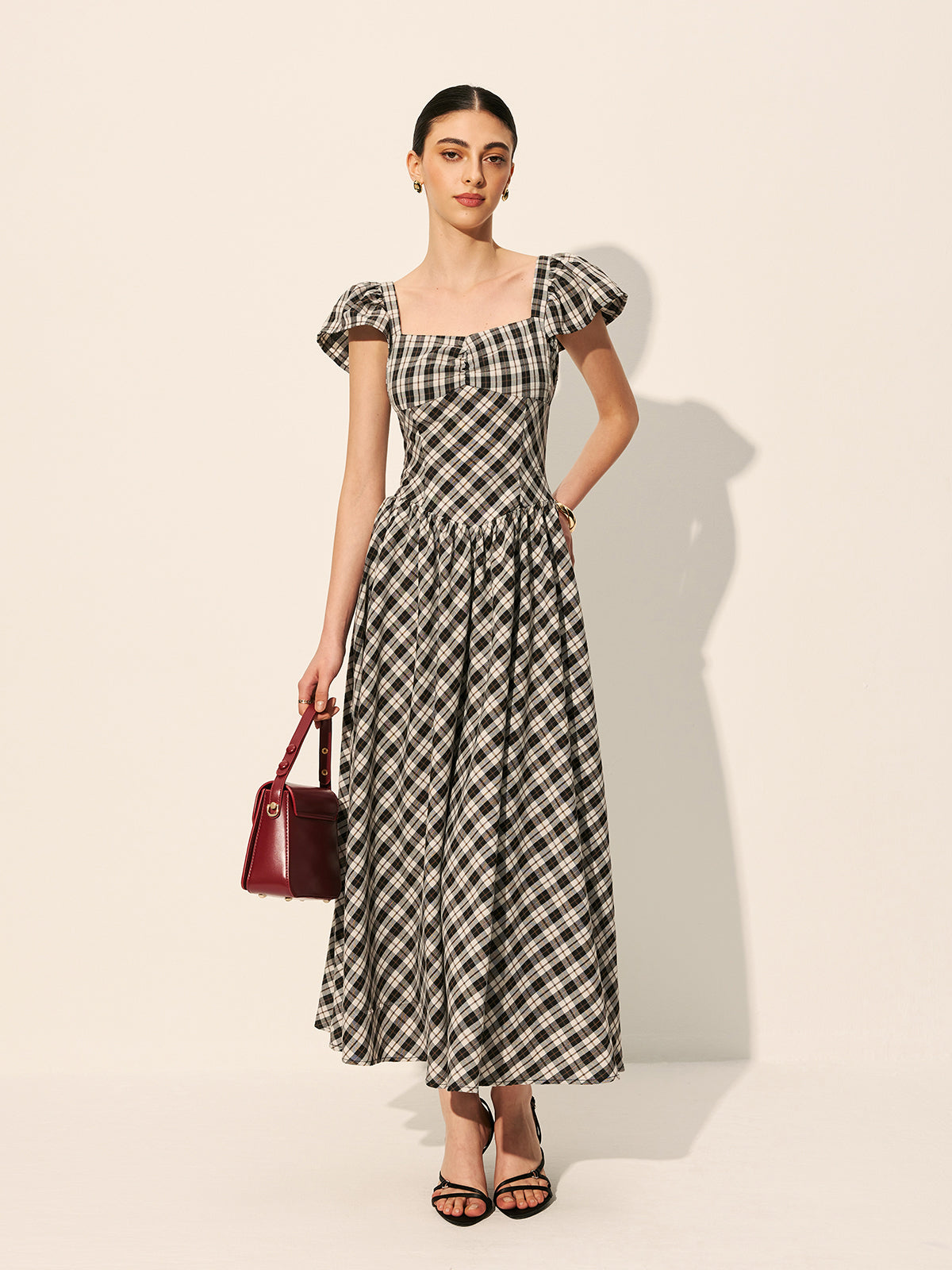 Majestweave – Kleid mit Puffärmeln und Schachbrettmuster 